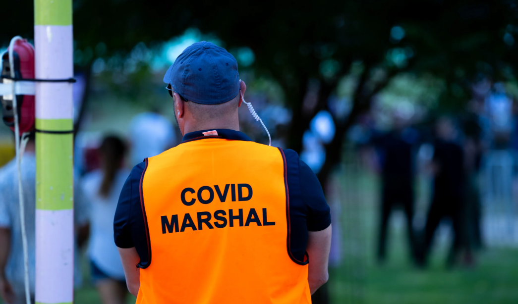 Agile Safety - Covid Marshall watching people enter an event