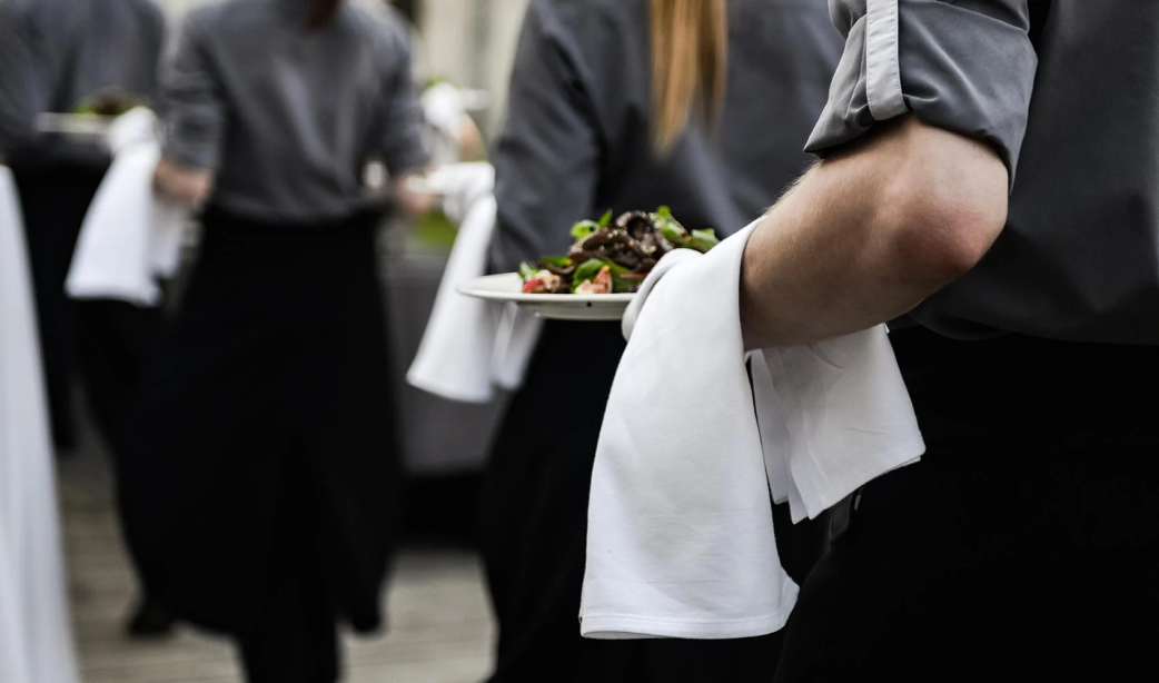 Agile Hospitality - Waitstaff serving meals in a dining hall